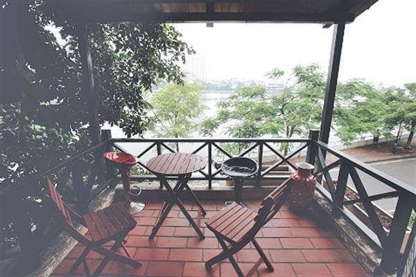 Lake view Villa with front yard to rent in Tay Ho, partial furniture